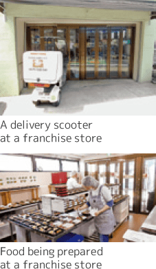 A delivery scooter and food being prepared at a franchise store